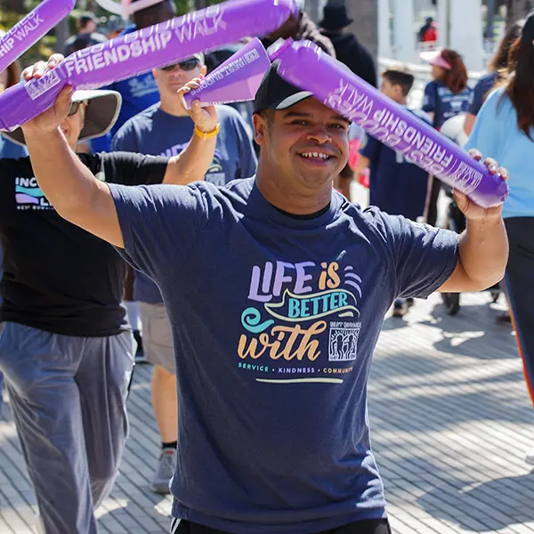 young male participant smiling at the event